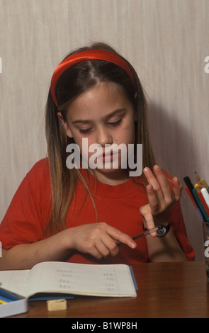 little girl doing maths homework Stock Photo