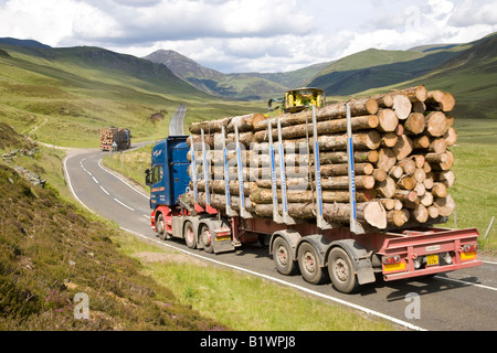 Braemar A93 Scottish timber industry, logging truck, cut logs, heavy haul road transport on a mountain road,  Cairngorms National Park, Scotland, UK Stock Photo