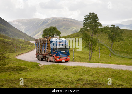 Braemar landscape A93 Scottish timber industry, Scania logging truck, road transport haulage on mountain road,  Cairngorms National Park, Scotland uk Stock Photo