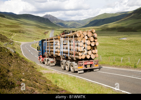 Braemar A93 Scottish timber industry, logging truck, cut logs, heavy haul road transport on a mountain road,  Cairngorms National Park, Scotland, UK Stock Photo