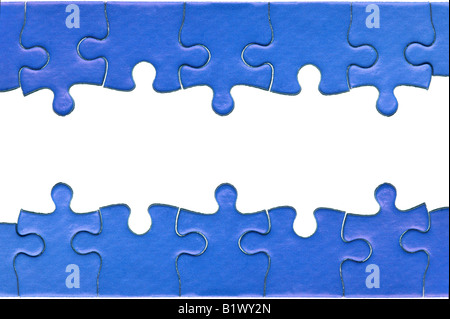 Pieces from a genuine blue jigsaw puzzle arranged to form a page header and footer isolated on a white background Stock Photo