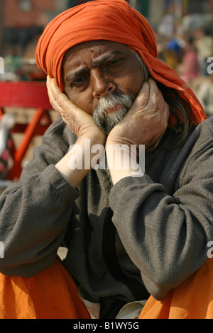Middle-aged Indian Hindu sadhu (guru, baba) with three yellow tilaka ...