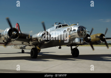 B17 Flying Fortress classic airplane restored, with all four engines running.