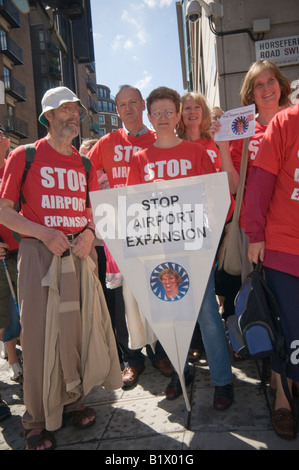 Stop Airport Expansion Flash Mob protest at DfT in Westminster against third runway for Heathrow with large paper plane Stock Photo