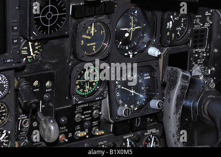 Airplane instrument panel showing pilot controls including navigation equipment, landing gear switch and control yoke. Stock Photo