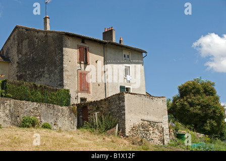 Stock photo of a French house on a hill The image of the house is set against a backdrop of the ble French sky Stock Photo