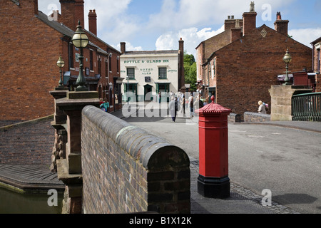 Village street with reconstructed buildings and Victorian postbox at the Black Country Living Museum, Dudley, West Midlands Stock Photo