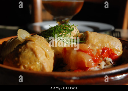 stuffed escalopes of veal with vegetables in a pottery plate Stock Photo