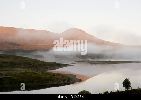 Early morning mist and clouds over Loch Achanalt, Highlands, Scotland Stock Photo