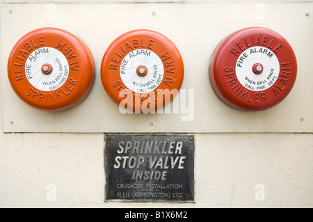 3 red fire alarms stop sprinkler valve sign 3 of 3 Stock Photo