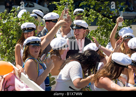 Students ride on truck platform during traditional celebration of High School Graduation Day in Gothenburg Sweden Jun 2008 Stock Photo