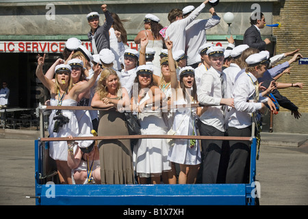 Students ride on truck platform during traditional celebration of High School Graduation Day in Gothenburg Sweden Jun 2008 Stock Photo