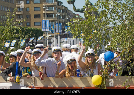 Students ride on truck platform during traditional celebration of High School Graduation Day in Gothenburg Sweden Jun 2008 Stock Photo