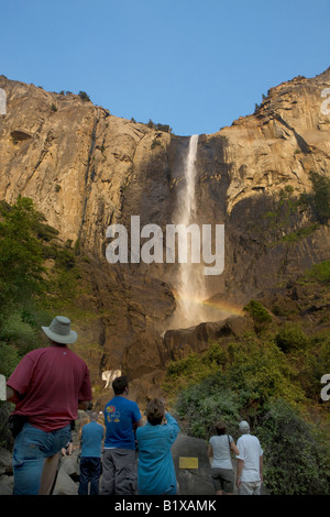 Tourists gaze at Bridalveil Fall, Yosemite National Park, California, USA. Stock Photo