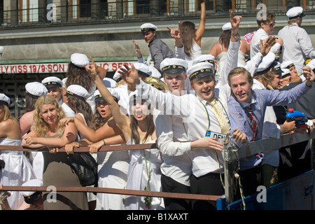 Students ride on truck platform during traditional celebration of High School Graduation Day in Gothenburg Sweden Jun 2008 Stock Photo