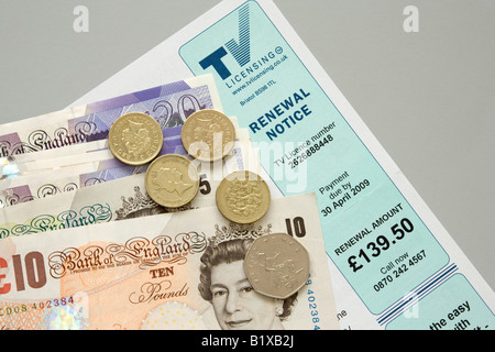 A television licence application form with cash to pay for it Stock Photo