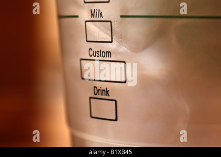 Custom drink served in a plastic cup. Can digitally tick either of the boxes. Coffee culture. Stock Photo