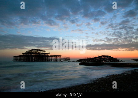 A dramatic sunset over Brighton's West Pier Stock Photo