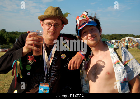 Two festival-going friends enjoy the music and the alcohol in the British sunshine at Bloom Festival 2007. Stock Photo