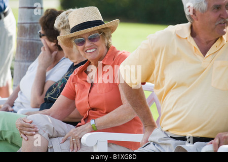 Group of people sitting together Stock Photo