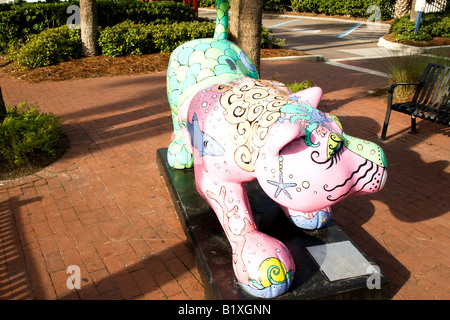 Artistic crouching multi-colored cat on a small pedestal in a town square in Atlantic  Beach, Florida Stock Photo