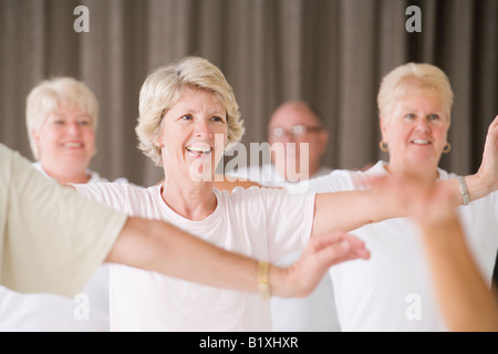 Senior people exercising in an exercise class Stock Photo