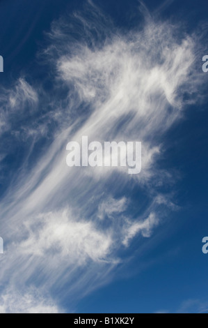 Cirrus Clouds in a bright blue sky in Scotland Stock Photo