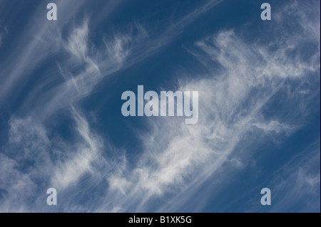 Cirrus Clouds in a bright blue sky in Scotland Stock Photo