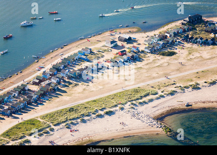 Aerial view of people and their beach huts at Mudeford, Hengistbury Head, Christchurch, Dorset. UK. Early evening sunshine. Stock Photo