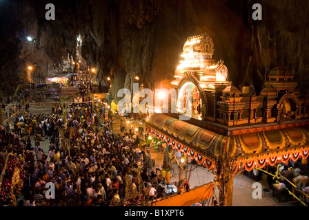 DEVOTEES IN FRONT OF TEMPLE INSIDE THE BATU CAVES DURING THE ANNUAL HINDU FESTIVAL OF THAIPUSAM KUALA LUMPUR MALAYSIA Stock Photo