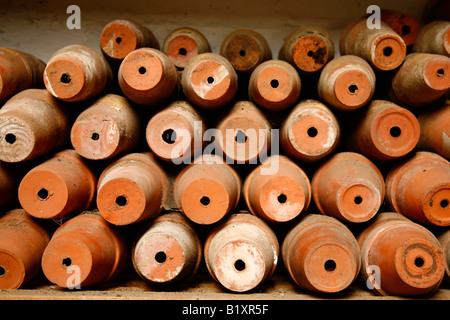 Old Plant flower pots Stacked on their side. Stock Photo