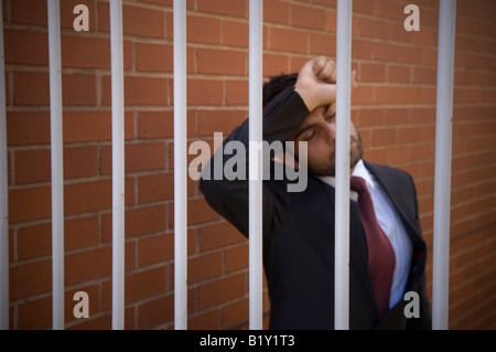 Business man in jail Stock Photo