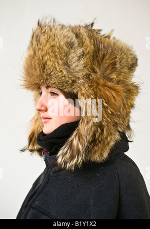 Young British  girl wearing a genuine Afghan fur hat with drop down ear flaps Stock Photo