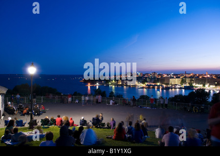 A crowd gathers on top of Fort Henry overlooking Kingston, Ontario to observe the Canada Day fireworks display on July 1st 2008. Stock Photo