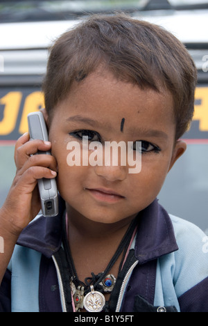 Rajasthani boy talking through a mobile phone, Rajasthan (India) Stock Photo