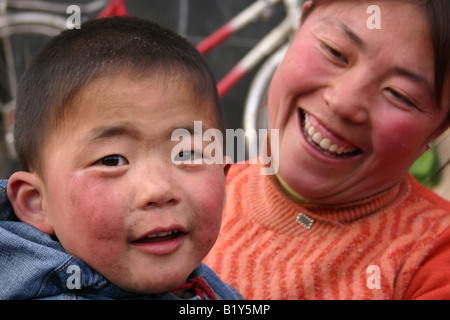 Scenes from the city of Langzhou capital of the Gansu province close to Mongolia in the north China: mother and child Stock Photo