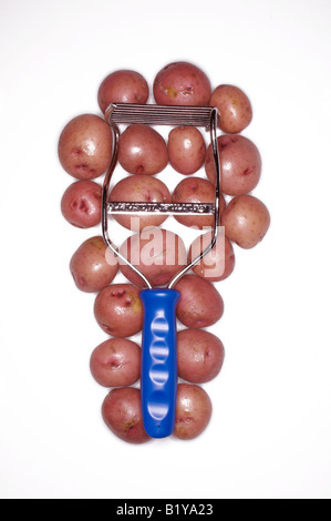 A blue handled potato masher with red potatoes. Stock Photo