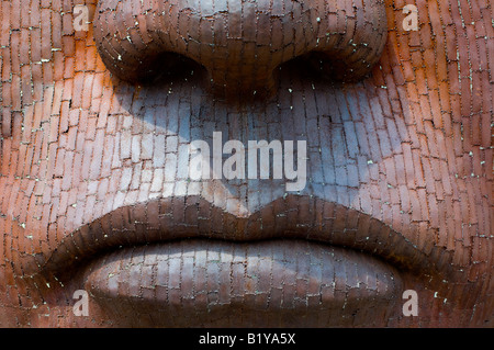 Close up of face sculpture which stands outside the Marlowe Theatre, Canterbury. Stock Photo