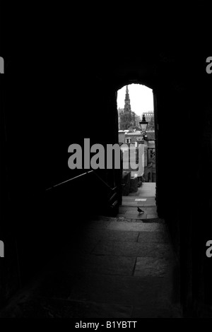 An unusual  view of Princes Street Edinburgh, Scotland, UK showing the Sir Walter Scott Monument - a framed shot from an alley Stock Photo