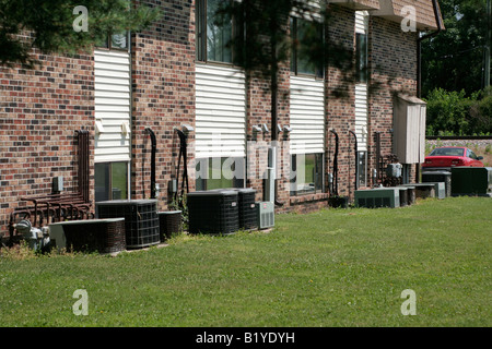 Heat pump units outside an apartment building Stock Photo
