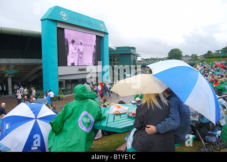 Rain delay on Murray Mount, The Championships, Wimbledon, Merton Borough, Greater London, England, United Kingdom Stock Photo