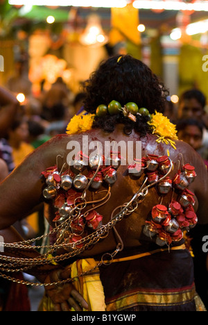 DEVOTEE WITH HOOK PIERCING IN BACK INSIDE THE BATU CAVES DURING THE ANNUAL HINDU FESTIVAL OF THAIPUSAM KUALA LUMPUR MALAYSIA Stock Photo