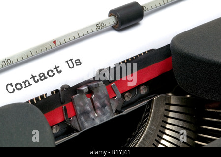 Contact Us typed on an old typewriter shot at an angle Stock Photo