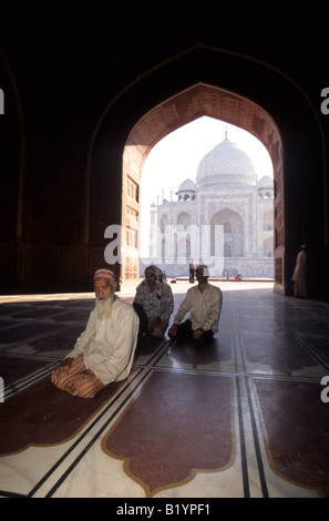 Muslims offer prayers in a mosque on the grounds of the Taj Mahal Stock Photo