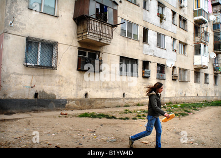 a romanian girl with bread, ferentari neighborhood Stock Photo