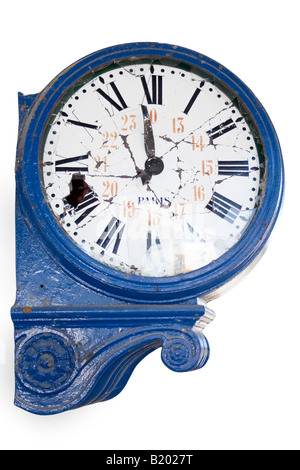 old and damaged retro clock with roman numeral from an abandoned train station Stock Photo