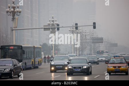 Heavy traffic and air pollution smog on crowded Beijing main street Chang An Avenue China Stock Photo