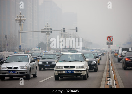 Heavy traffic congestion and smog air pollution on Beijing main street Chang An Avenue China Stock Photo
