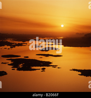 Sunrise over the Mula-Mutha river at Pune (Poona)India. Pune is a Military and Industrial city, 2nd only toBombay in Maharashtra Stock Photo