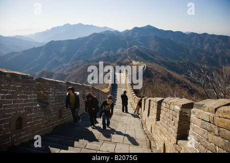 Tourists walk the ancient Great Wall of China at Mutianyu north of Beijing formerly Peking China Stock Photo